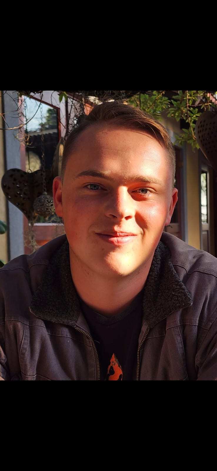 Portrait of the founder smiling outdoors